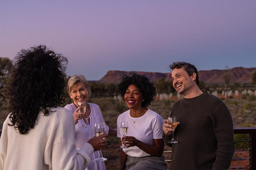 People drinking wine at Ayers Rock on Piti Sightseeing Adventure with AAT Kings