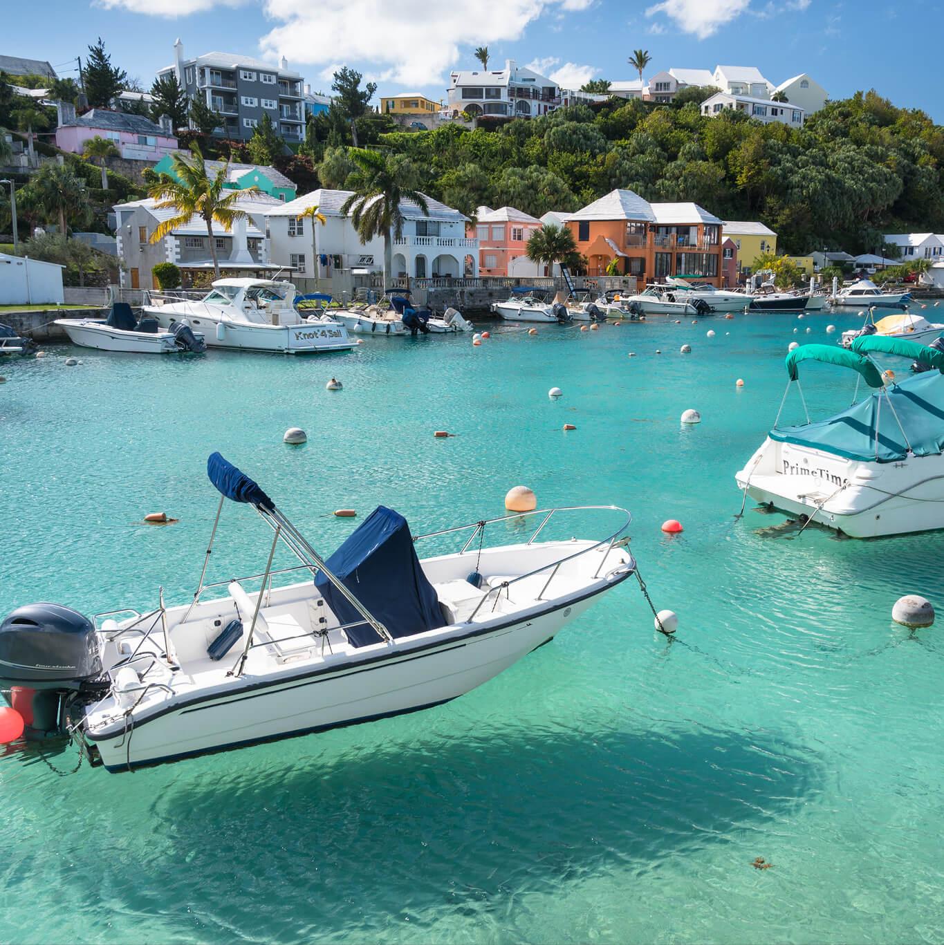 Boats docked near colorful buildings of Bermuda