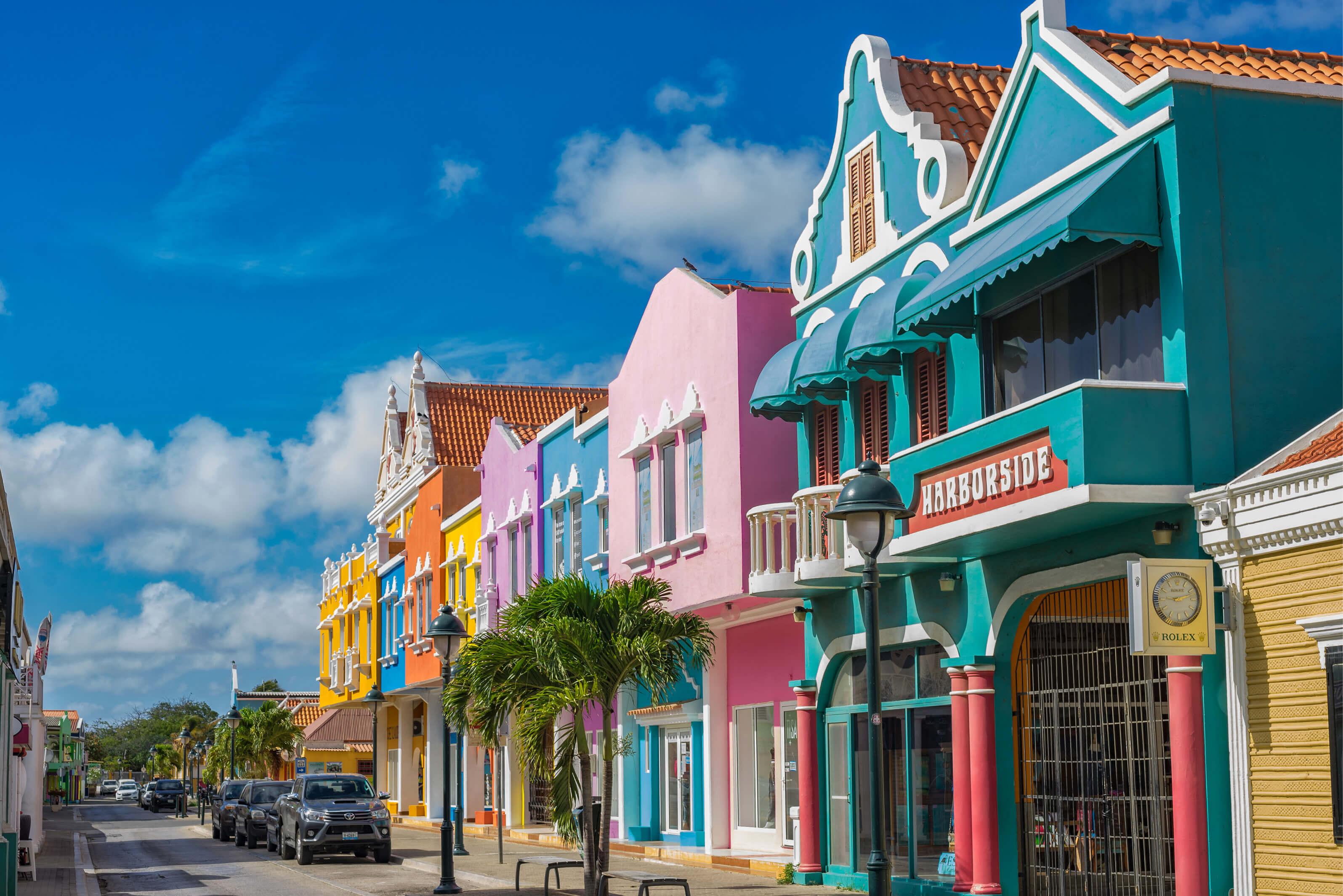 A vibrant city street lined with colorful buildings in Bonaire