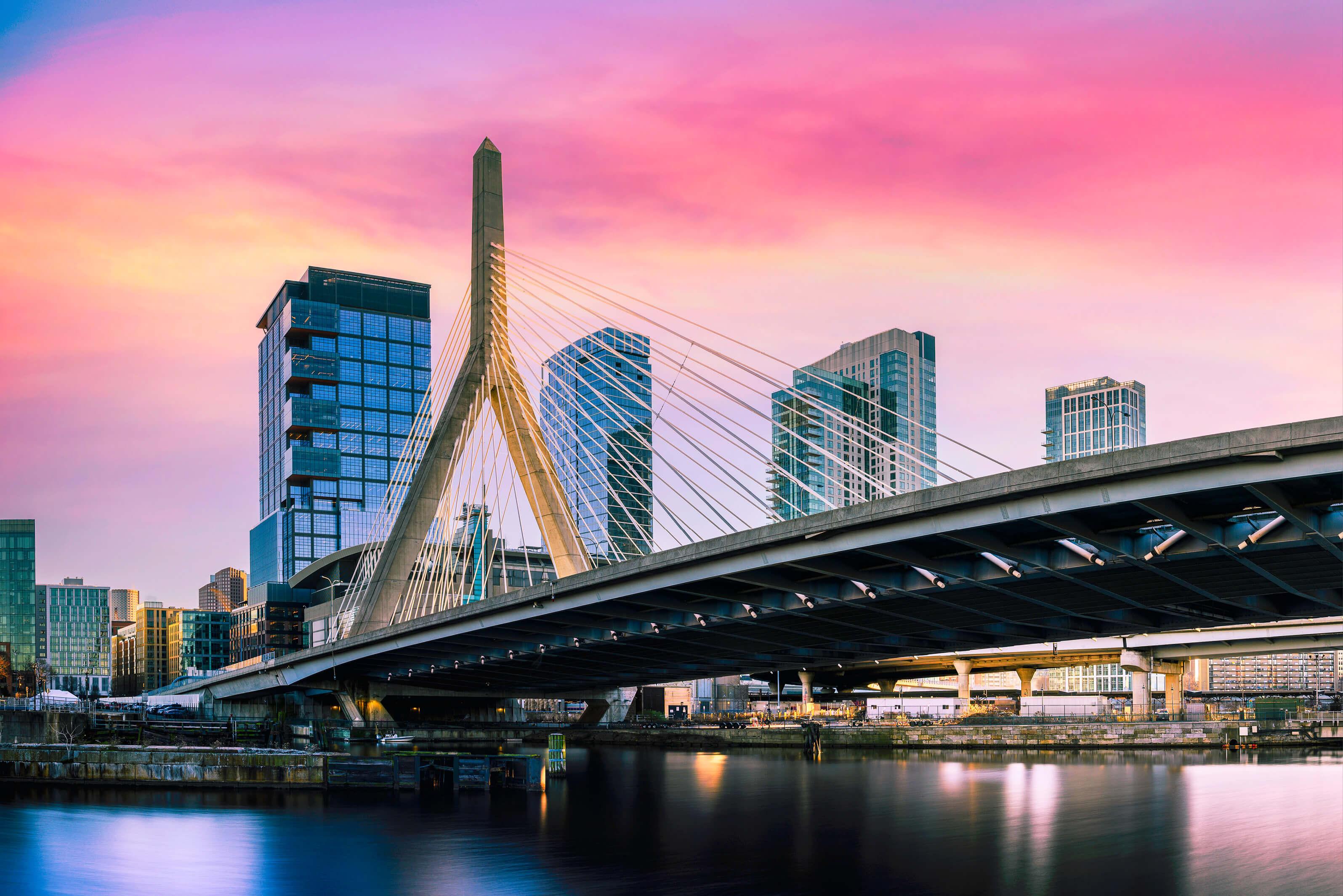 The Zakim Bridge spans the Charles River in Boston, Massachusetts, showcasing its distinctive cable-stayed design