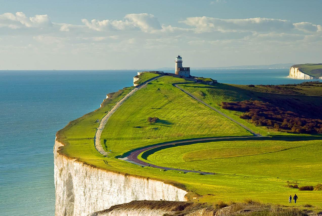 The striking white cliffs of Dover, England, stand tall along the coastline, showcasing natural beauty and historical significance