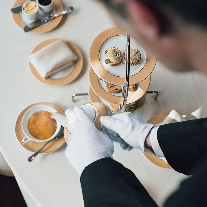 Butler serving afternoon tea