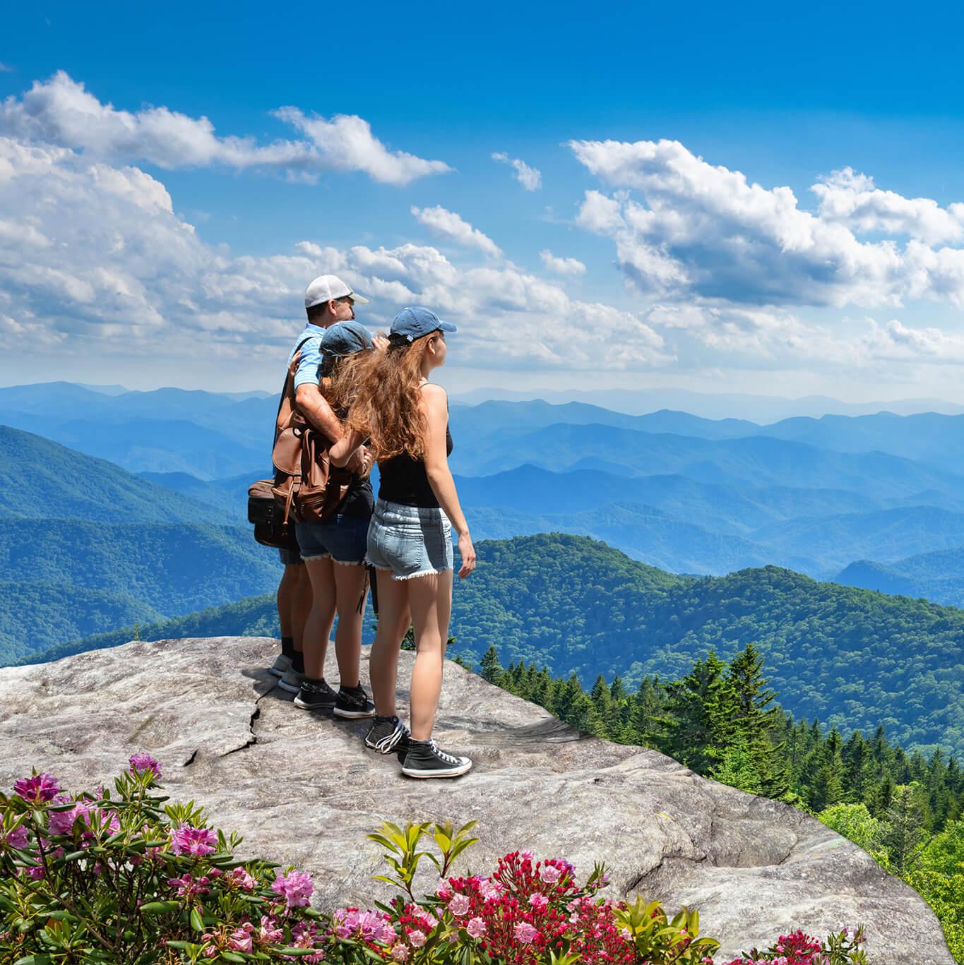 Hikers overlook a scenic view in the Great Smoky Mountains